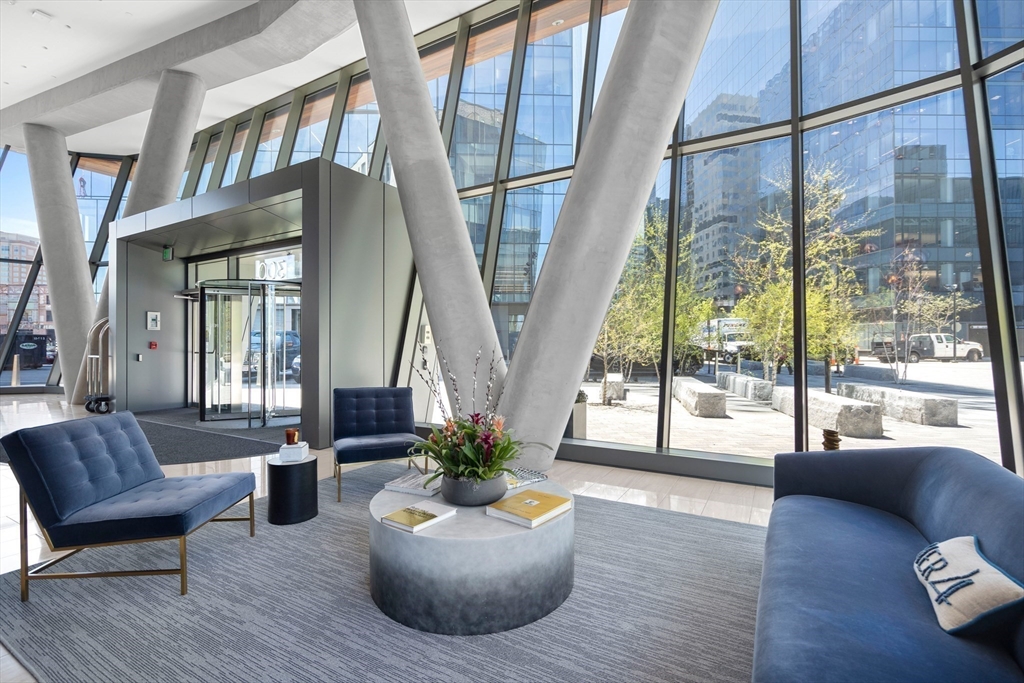 300 Pier 4 Blvd., Unit PHR Boston, MA 02210 - Photo 25 of 28 a living room with furniture and a potted plant