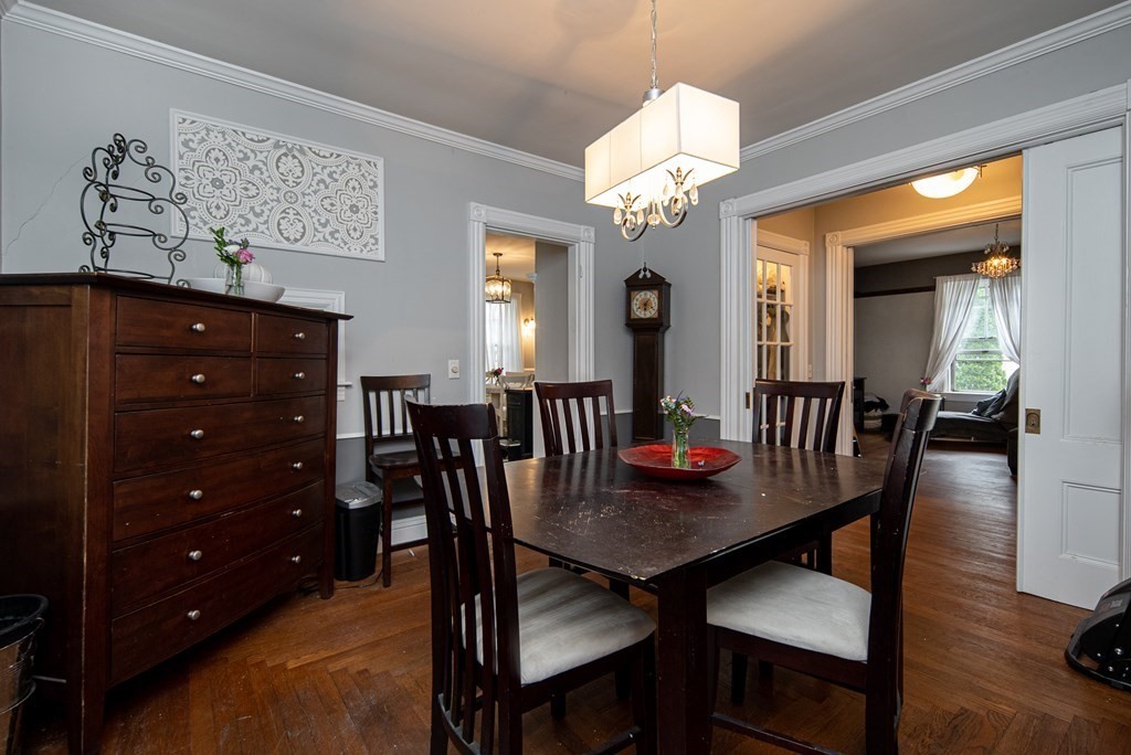 1571 Mendon Road Cumberland, RI 02864 - Photo 11 of 26 a view of a dining room with furniture and wooden floor