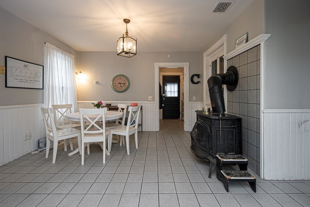 1571 Mendon Road Cumberland, RI 02864 - Photo 14 of 26 a view of a dining room with furniture and chandelier