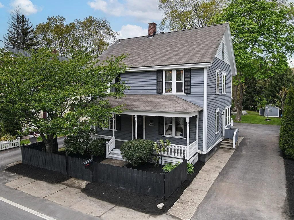 1571 Mendon Road Cumberland, RI 02864 - Photo 2 of 26 a front view of a house with garden