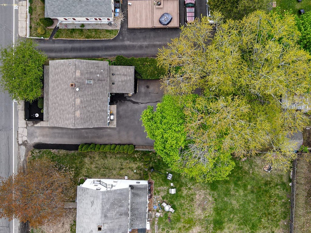 1571 Mendon Road Cumberland, RI 02864 - Photo 22 of 26 an aerial view of a house with a garden