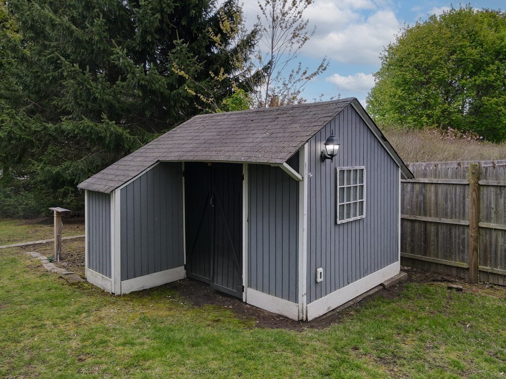 1571 Mendon Road Cumberland, RI 02864 - Photo 23 of 26 a view of a house with a backyard