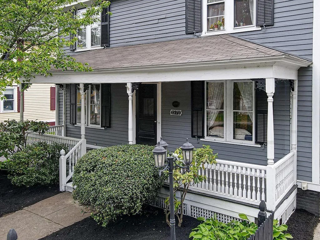 1571 Mendon Road Cumberland, RI 02864 - Photo 3 of 26 a front view of a house with a garden