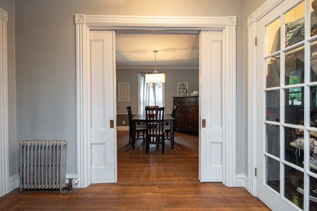 1571 Mendon Road Cumberland, RI 02864 - Photo 10 of 26 a view of a hallway with wooden floor and dining room