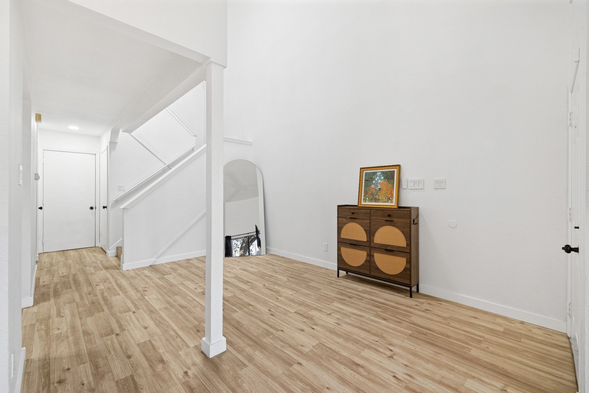 1010 West Rundberg Lane, Unit 30 Austin, TX 78758 - Photo 3 of 30 a view of a livingroom with wooden floor and furniture