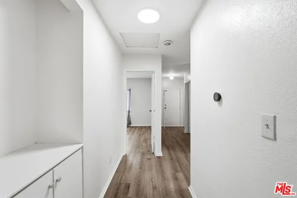 a view of a bathroom with a sink and a mirror