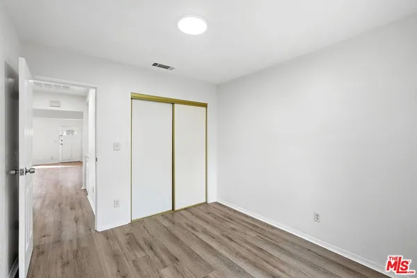 a view of a livingroom with wooden floor