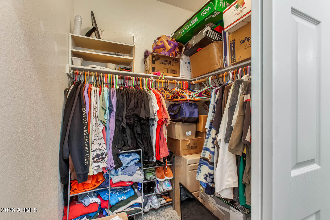 1425 South Lindsay Road, Unit 59 Mesa, AZ 85204 - Photo 14 of 23 a view of walk in closet with clothes and shoes