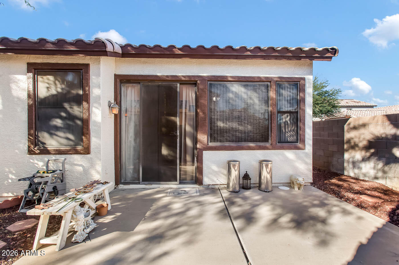 1425 South Lindsay Road, Unit 59 Mesa, AZ 85204 - Photo 20 of 23 a view of a house with a yard and garage