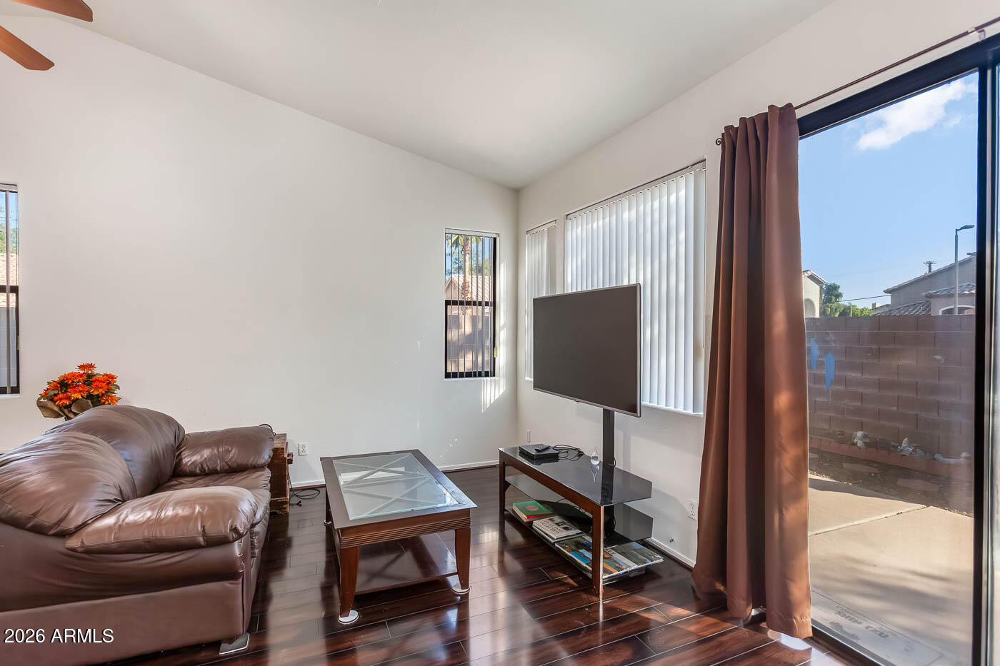 1425 South Lindsay Road, Unit 59 Mesa, AZ 85204 - Photo 4 of 23 a living room with furniture and a flat screen tv