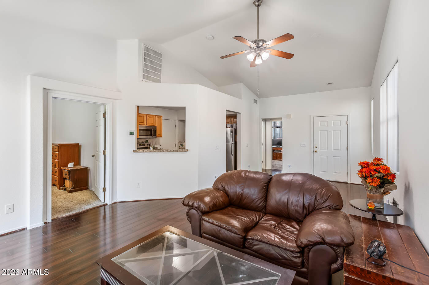 1425 South Lindsay Road, Unit 59 Mesa, AZ 85204 - Photo 5 of 23 a living room with furniture and wooden floor