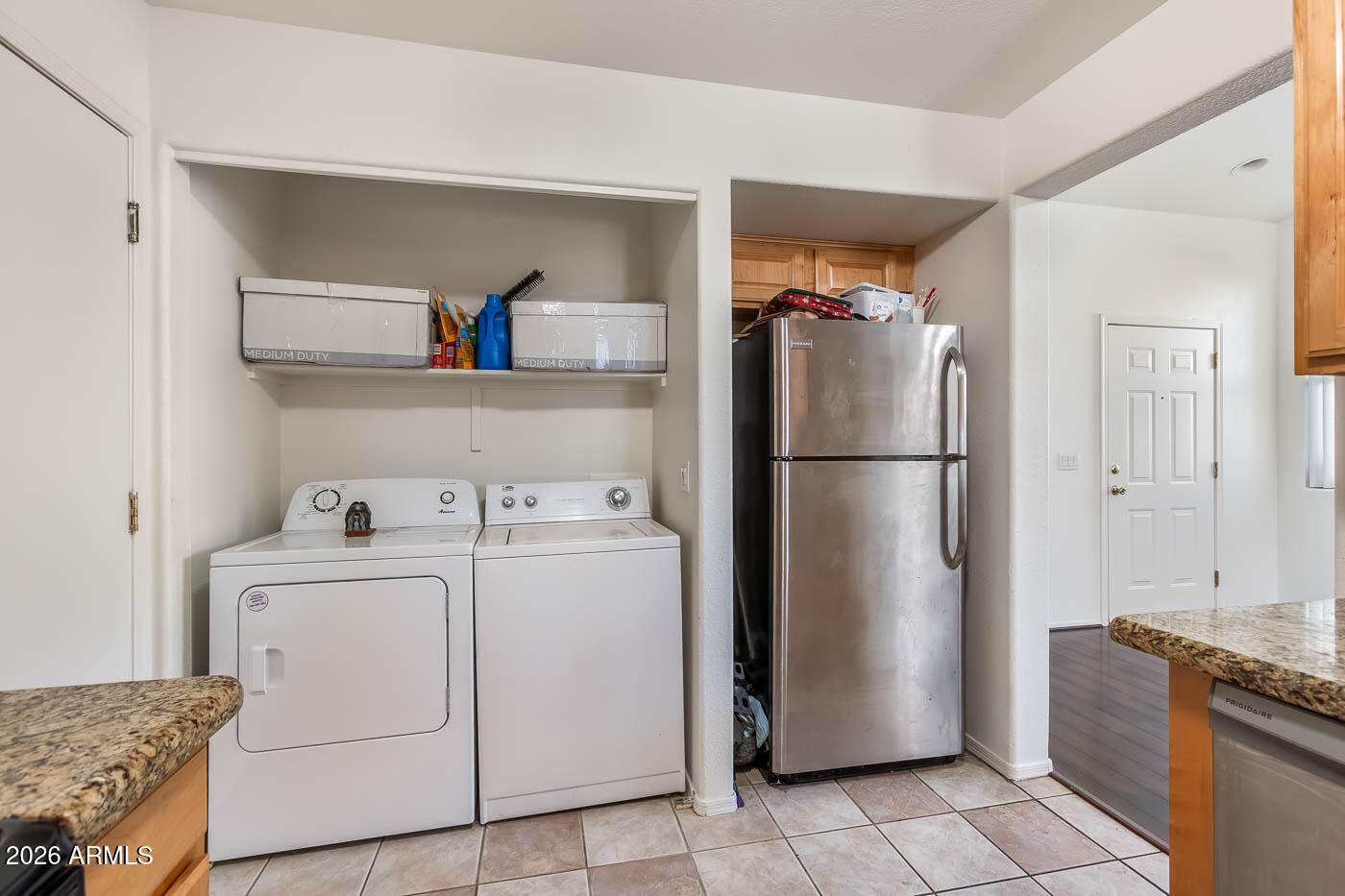 1425 South Lindsay Road, Unit 59 Mesa, AZ 85204 - Photo 8 of 23 a utility room with dryer and washer