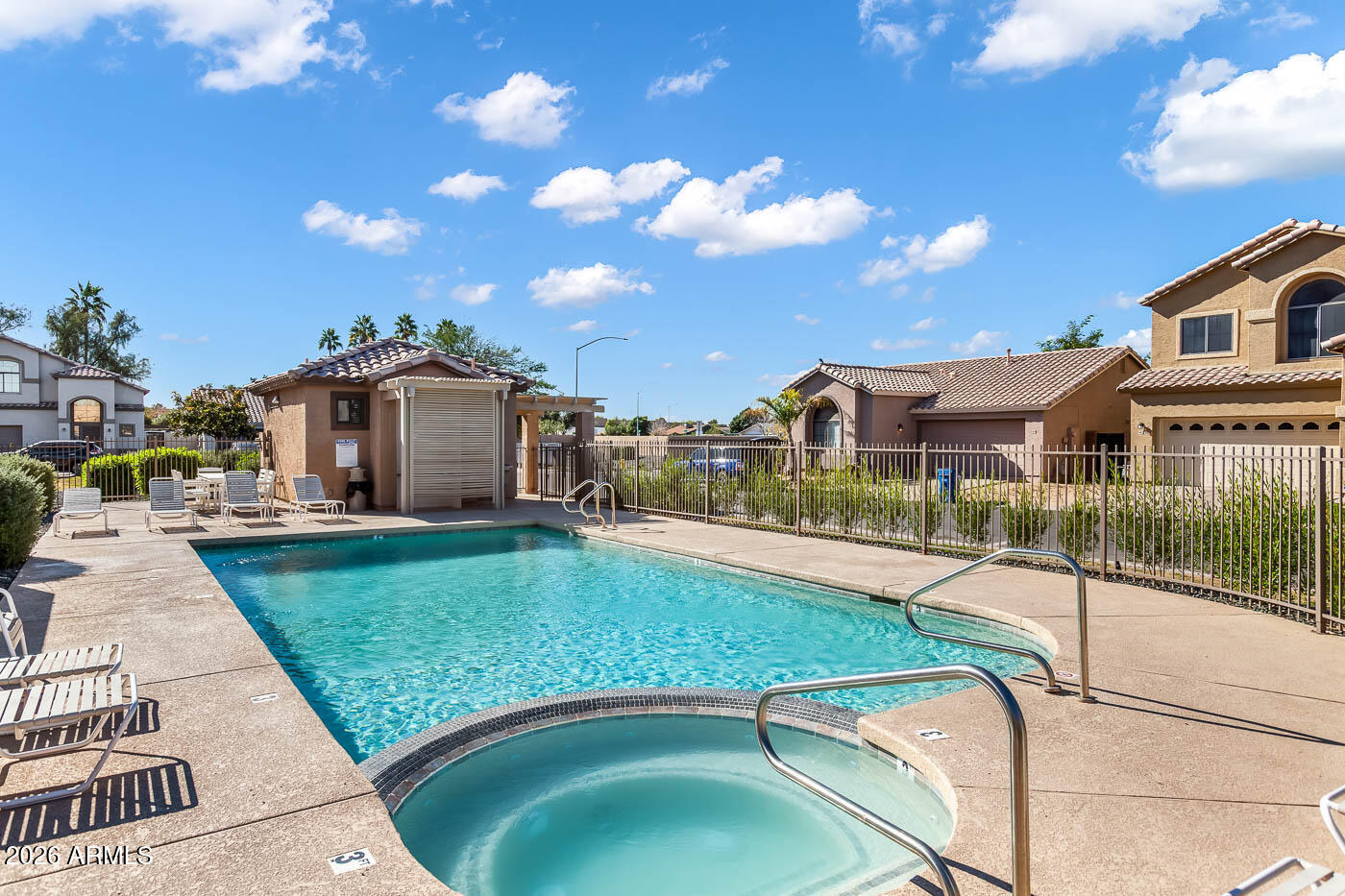 1425 South Lindsay Road, Unit 59 Mesa, AZ 85204 - Photo 10 of 23 a swimming pool with outdoor seating and yard