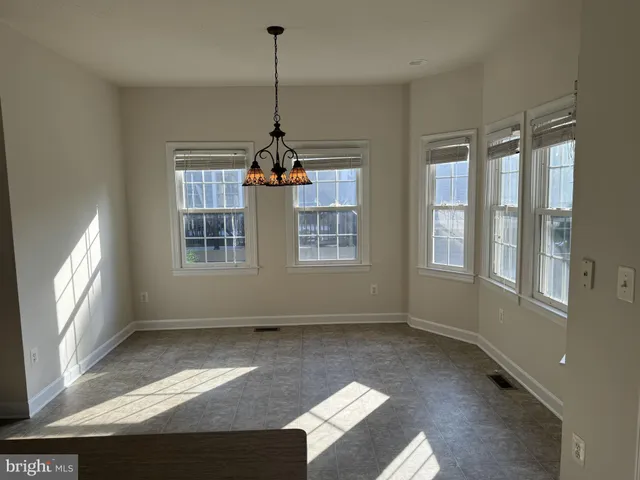 a view of empty room with windows