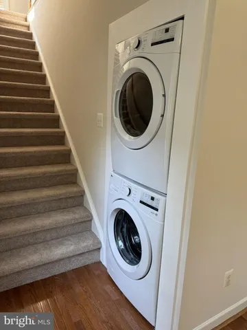 a view of a hallway with washer and dryer