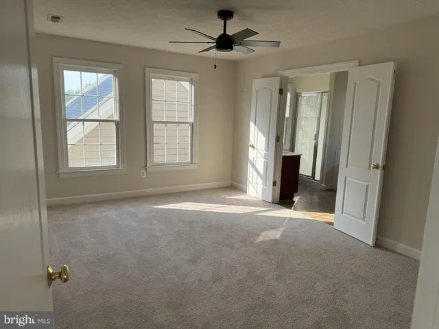 a bathroom with a tub and shower