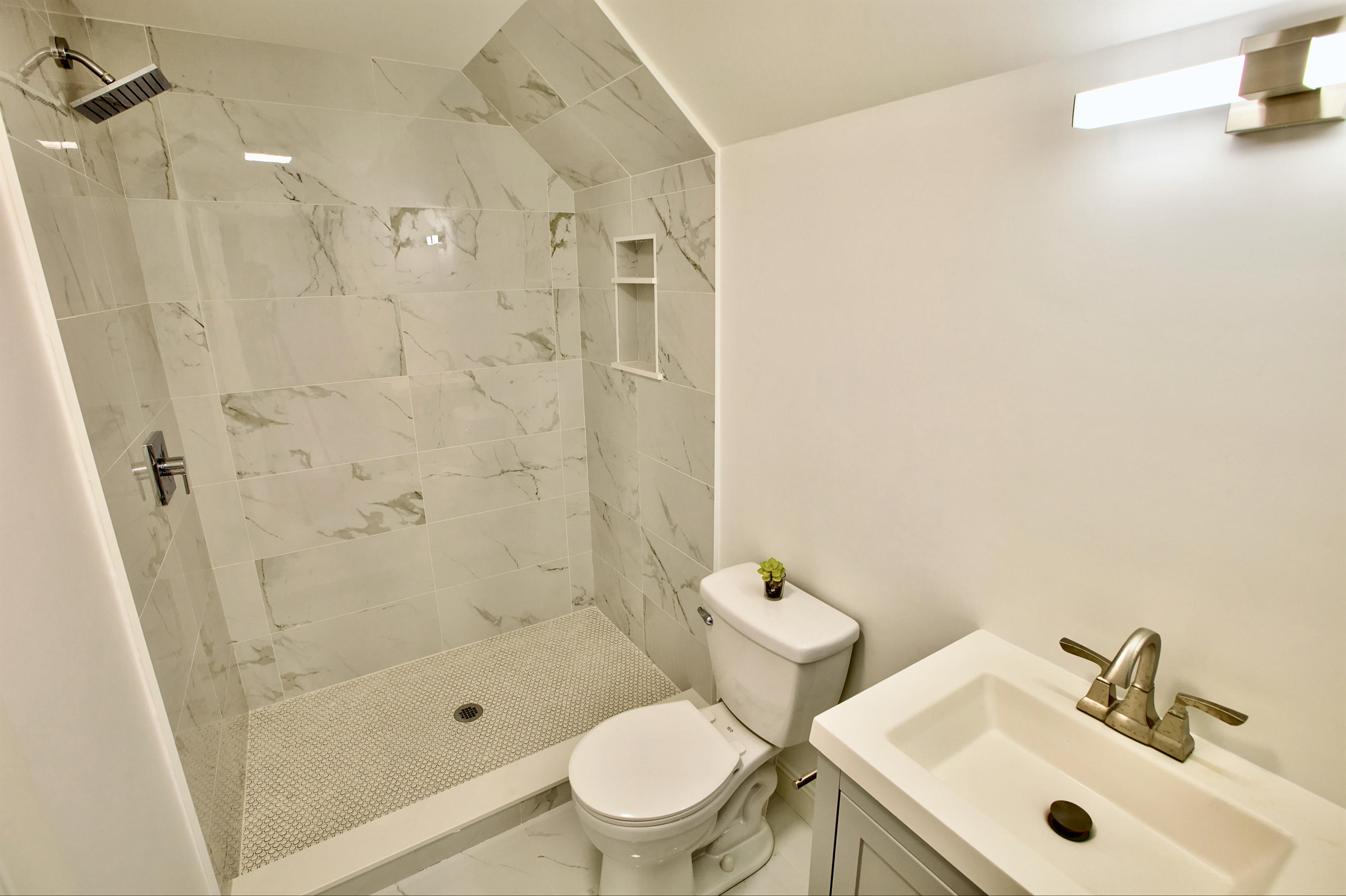 32 Cap'n Lijah's Road Centerville, MA 02632 - Photo 33 of 38 a bathroom with a sink toilet and shower