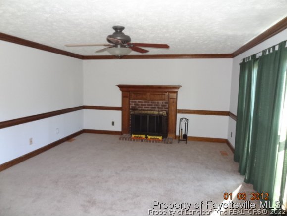 204 Renton Court Fayetteville, NC 28311 - Photo 11 of 25 a view of an empty room with a fireplace