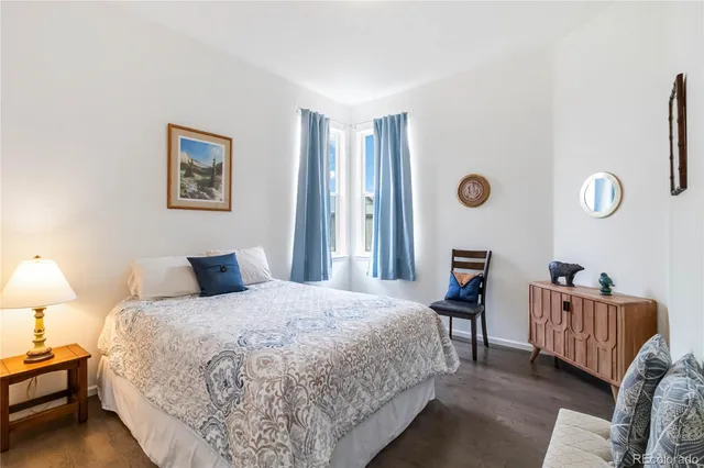 a bedroom with a bed and a lamp