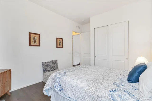 a bedroom with a bed and a cabinets