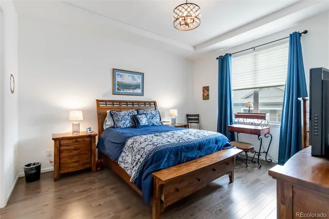 a bedroom with a bed and a table