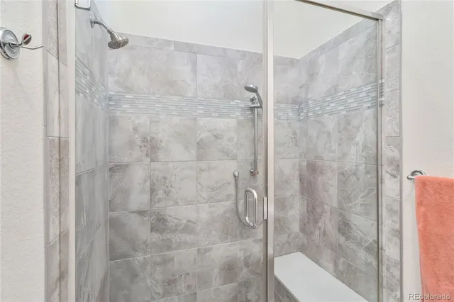 a bathroom with a shower and toilet