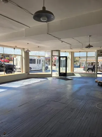 a living room with lots of furniture and a chandelier