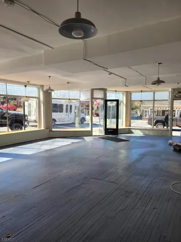 a living room with lots of furniture and a chandelier