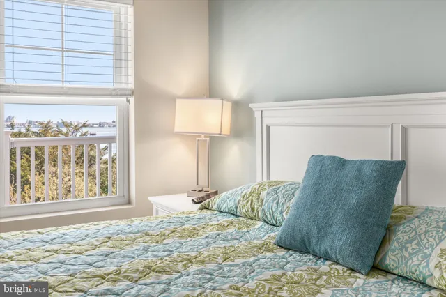 a view of a balcony with wooden floor and fence