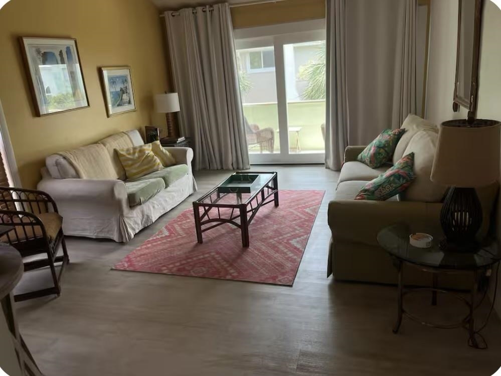 a living room with furniture and a window