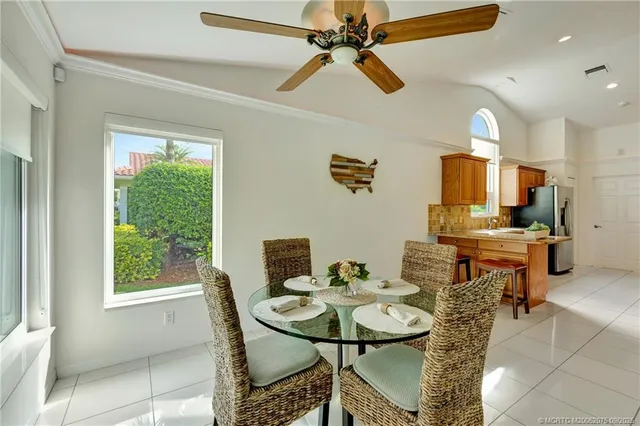 a view of a dining room with furniture and a window