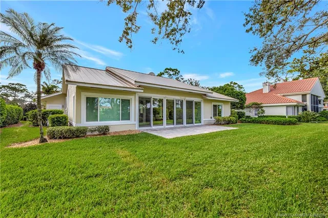 front view of a house with a garden