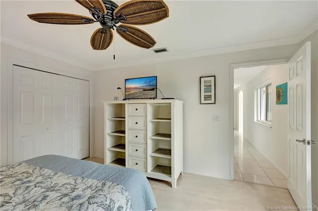 a bedroom with a bed and a cabinets