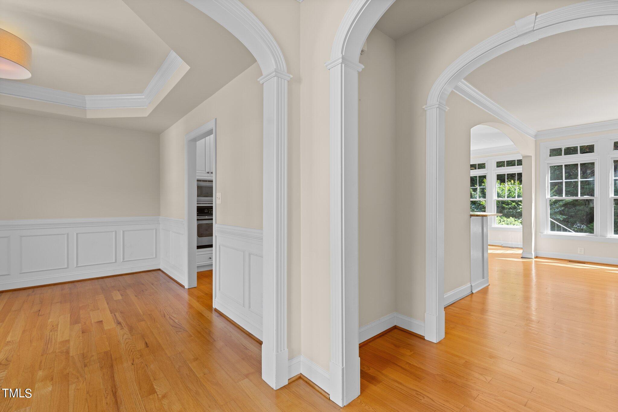 12228 Beestone Lane Raleigh, NC 27614 - Photo 4 of 36 a view of an empty room with wooden floor