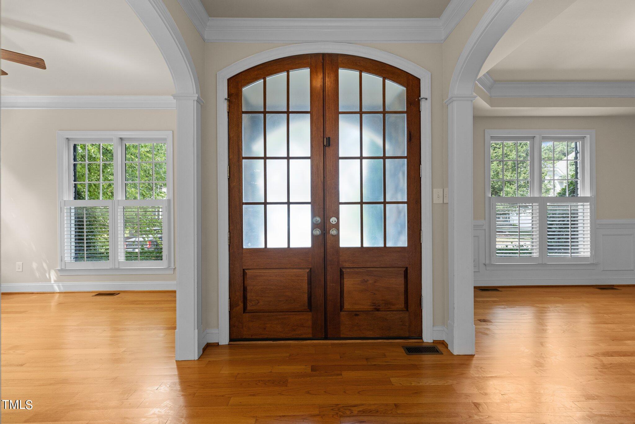 12228 Beestone Lane Raleigh, NC 27614 - Photo 5 of 36 an empty room with wooden floor and windows