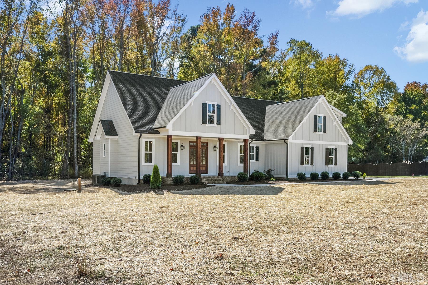 10316 Ten-Ten Road Raleigh, NC 27603 - Photo 2 of 3 a front view of a house with a yard