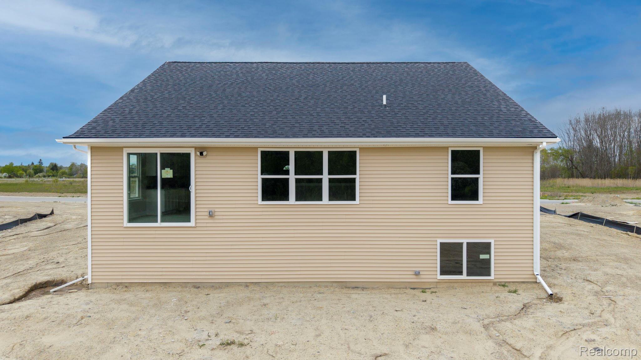 2281 Baltimore Davison, MI 48423 - Photo 25 of 26 Back of house featuring roof with shingles