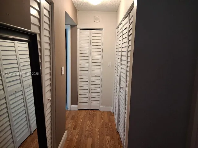 a bathroom with a sink vanity and a mirror