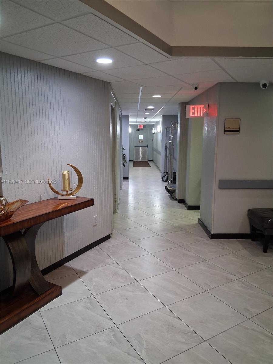 1400 St Charles Place, Unit 201 Pembroke Pines, FL 33026 - Photo 3 of 23 a view of a hallway with stairs