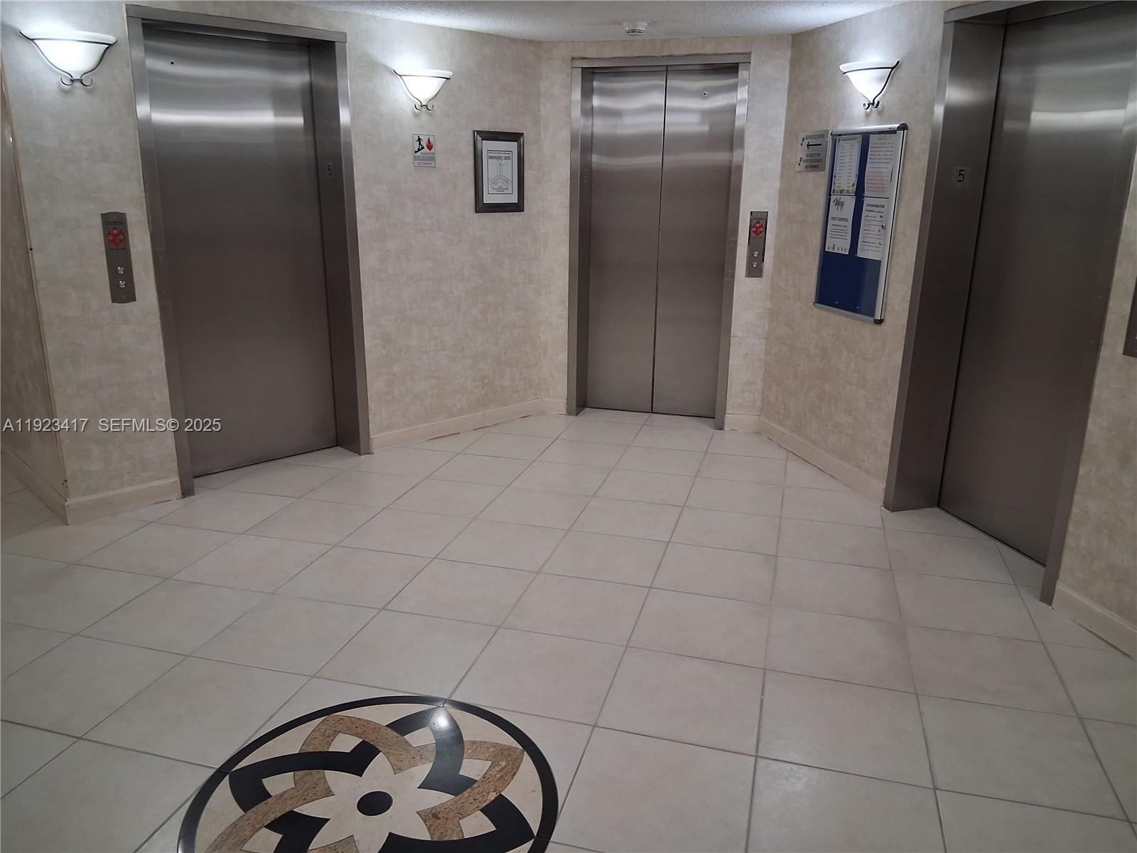 1400 St Charles Place, Unit 201 Pembroke Pines, FL 33026 - Photo 5 of 23 a view of hallway with elevator