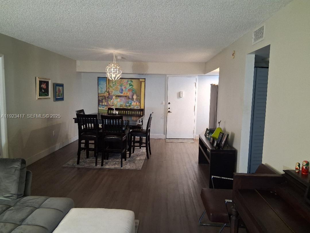 1400 St Charles Place, Unit 201 Pembroke Pines, FL 33026 - Photo 8 of 23 a view of a dining room with furniture