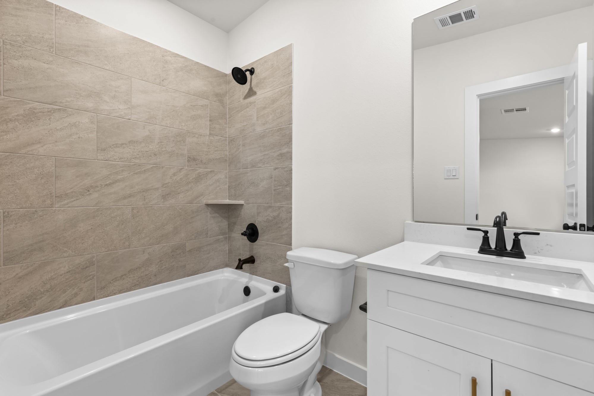 3518 Windmill Palm Manvel, TX 77578 - Photo 17 of 21 a bathroom with a sink a toilet and a bathtub