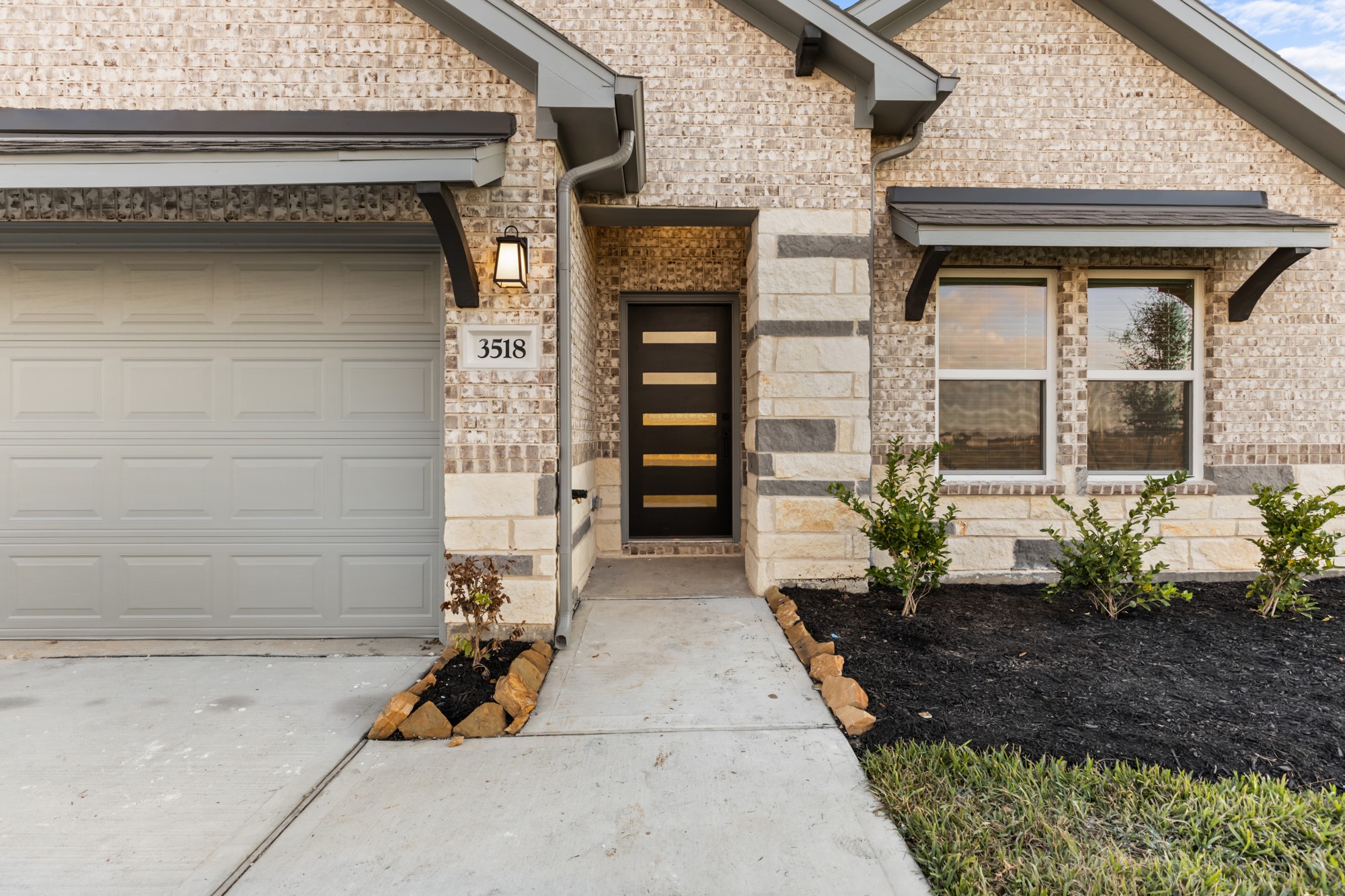 3518 Windmill Palm Manvel, TX 77578 - Photo 2 of 21 a front view of a house with a garden