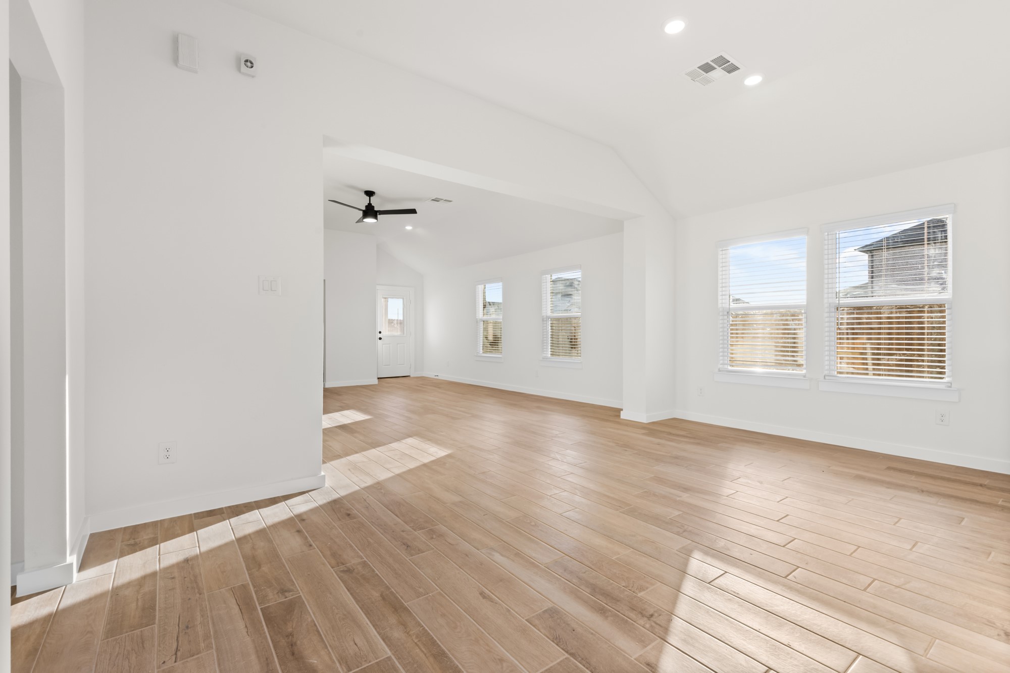 3518 Windmill Palm Manvel, TX 77578 - Photo 4 of 21 wooden floor in an empty room with a window