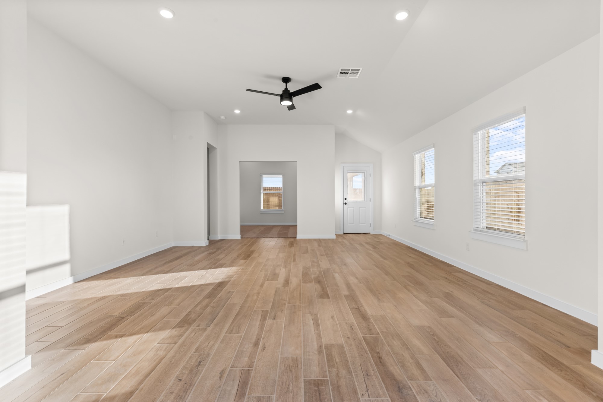 3518 Windmill Palm Manvel, TX 77578 - Photo 6 of 21 wooden floor in an empty room with a window