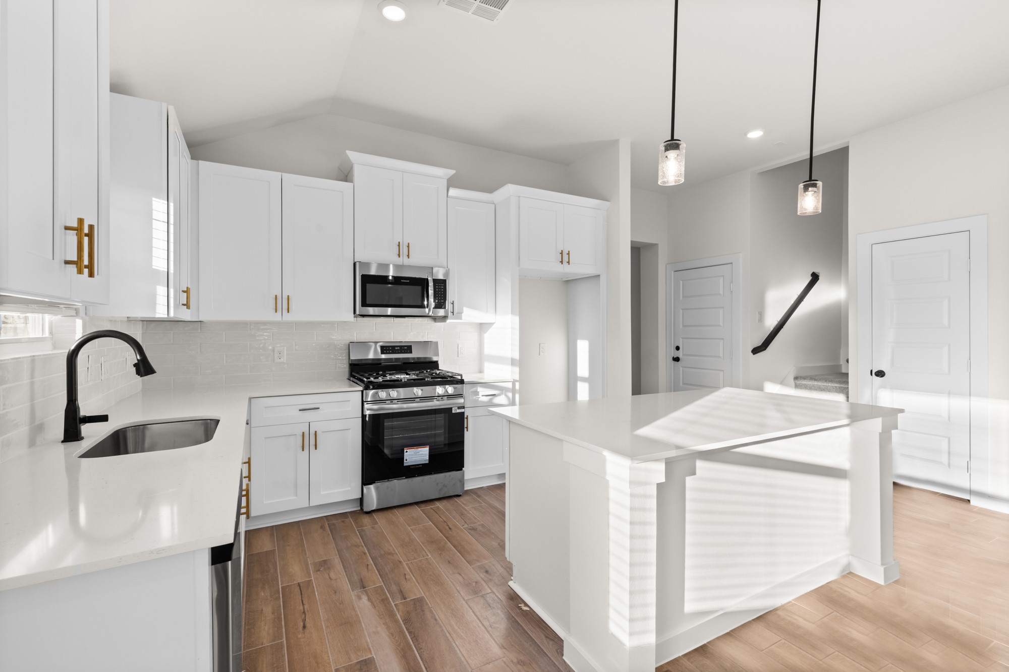 3518 Windmill Palm Manvel, TX 77578 - Photo 8 of 21 a kitchen with stainless steel appliances kitchen island a sink a stove and a refrigerator