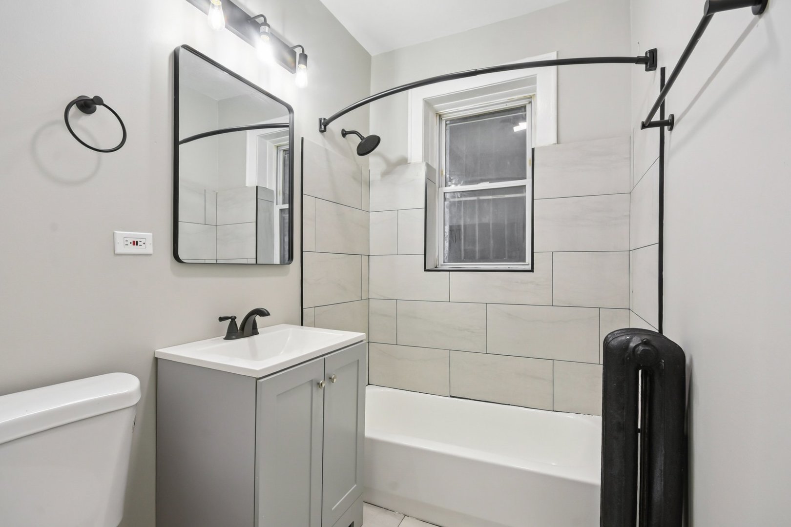 2444 East 78th Street, Unit 1 Chicago, IL 60649 - Photo 6 of 14 a bathroom with a shower a toilet and sink
