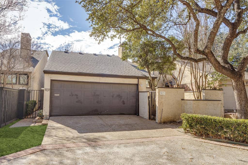 9838 Baseline Drive Dallas, TX 75243 - Photo 2 of 33 a view of garage yard and tree
