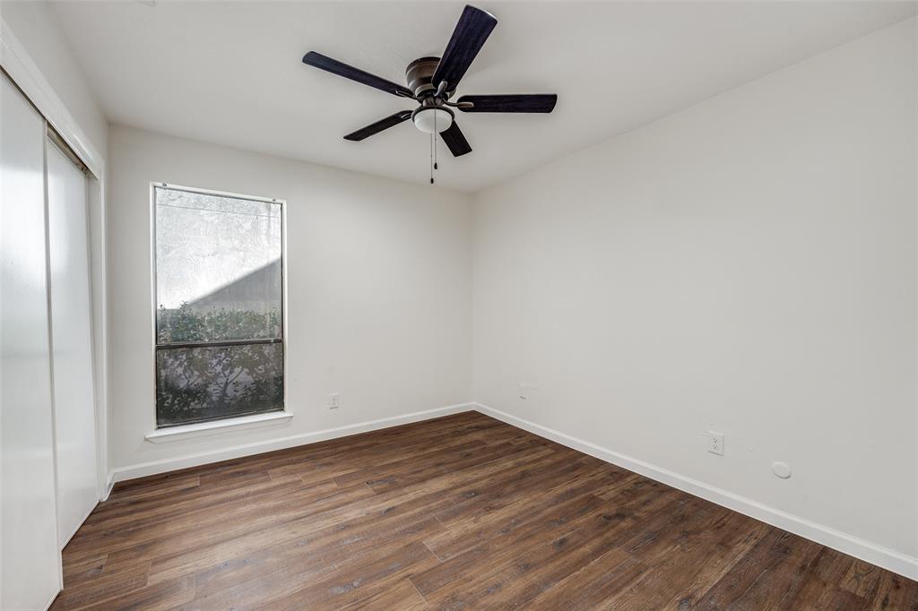 9838 Baseline Drive Dallas, TX 75243 - Photo 24 of 33 wooden floor in an empty room with a window