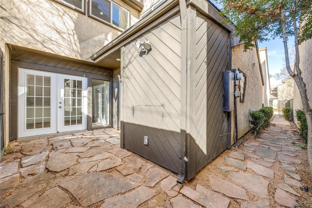 9838 Baseline Drive Dallas, TX 75243 - Photo 26 of 33 a view of a house with a wooden fence